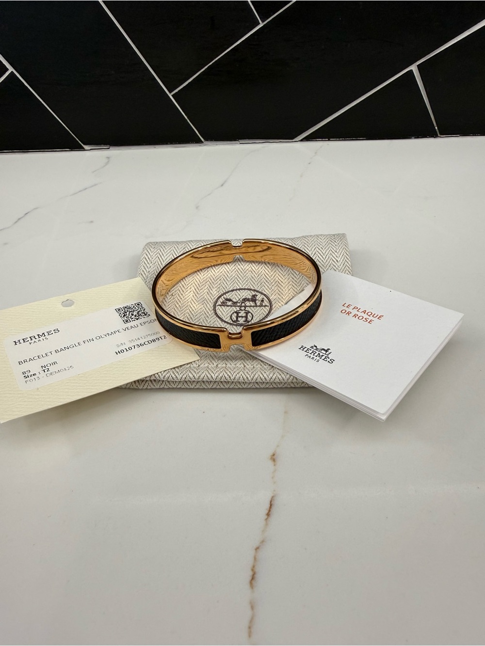 Hermes bangle Olympe Veau rose gold and noir Epsom. Size T2.